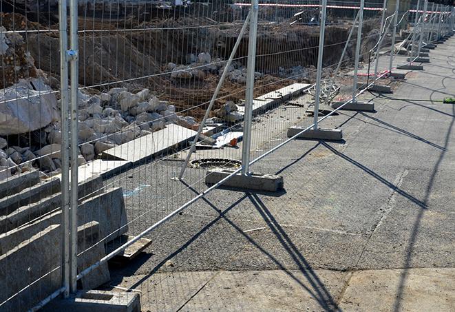 a view of temporary fence panels set up for crowd control at an event